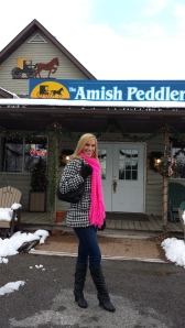 In front of the Amish Peddler, a gorgeous store full of handmade Amish goods. "English" and Amish teamwork at its finest!
